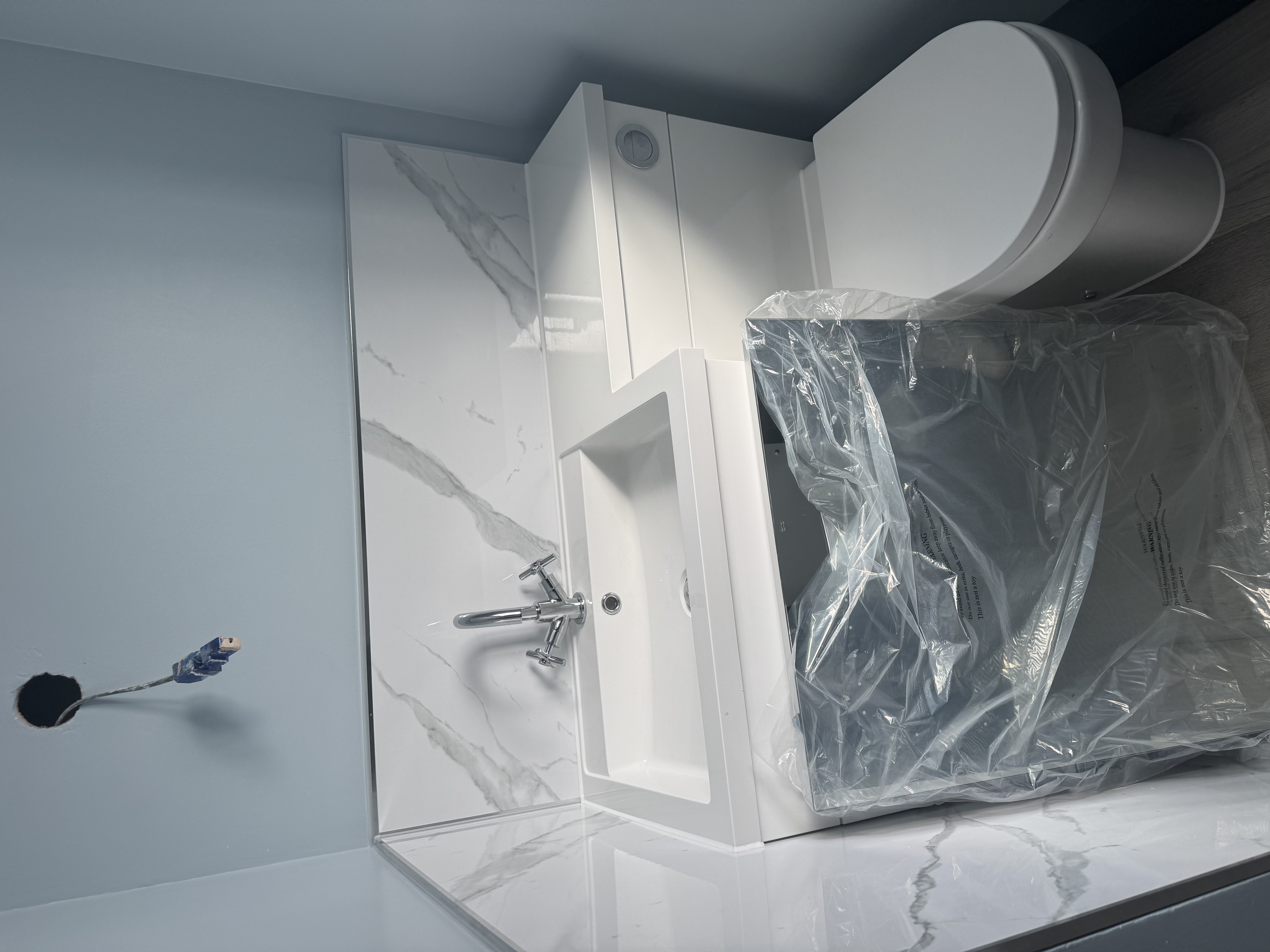 Bathroom fitting and toilet installation completed by The Leak & Heat Co.